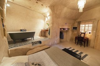Ever Wanted to Stay in a Cave That’s Actually Pretty Modern Inside? - Photo 4 of 10 - Located in converted caves in the Nazelles-Négron commune in France's Loire Valley, Amboise Troglodyte is a cozy, modern B&B that has a tiled nook bath area.