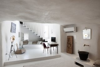 Ever Wanted to Stay in a Cave That’s Actually Pretty Modern Inside? - Photo 5 of 10 - After relocating from Milan to the small Baroque town of Modica in Sicily, architect couple Marco Giunta and Viviana Haddad purchased and restored an old house they found with locally sourced stones, tiles, and plaster. They now operate it as Casa Talia, a boutique hotel where guests can experience life at a more leisurely pace.