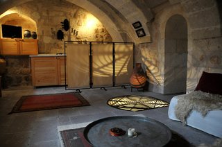 Ever Wanted to Stay in a Cave That’s Actually Pretty Modern Inside? - Photo 9 of 10 - Each of the three suites of Asmali Cave House in Cappadocia come with a living room, kitchen, spacious bedrooms, and unusual bathroom.