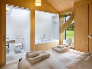 Take a Modern British Holiday in a Gleaming Cantilevered Barn - Photo 7 of 10 -