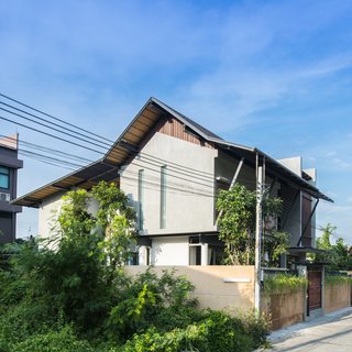 Cool, Asian Courtyard Home With A Brutalist Core - Photo 1 of 10 -