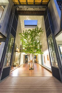 Cool, Asian Courtyard Home With A Brutalist Core - Photo 2 of 10 -