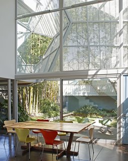 To create privacy, Kevin Daly Architects created a two-story glazed facade facing a landscaped courtyard, and shaded it with a perforated, folding metal skin that’s supported by an aluminum exoskeleton.