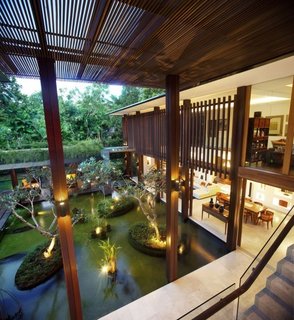 This house in Singapore was designed to be used without air-conditioning. When designing the space, the architect considered a number of factors, including increased ventilation, coolness, and protection from the strong heat and torrential rains.