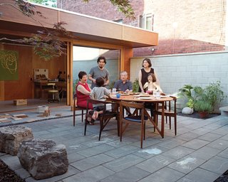 The courtyard in this Toronto home is where the family can catch some sun during the warm summer months, while still maintaining their privacy.