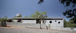 An Architect’s Bright and Airy Family Home Thrives Within a Brutalist Concrete Structure - Photo 1 of 12 -