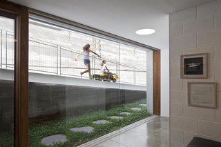 An Architect’s Bright and Airy Family Home Thrives Within a Brutalist Concrete Structure - Photo 3 of 12 -