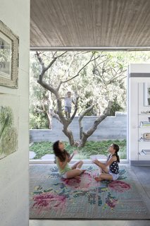 An Architect’s Bright and Airy Family Home Thrives Within a Brutalist Concrete Structure - Photo 10 of 12 -