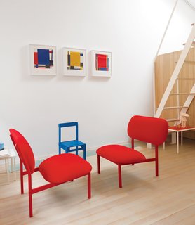 9 Small Spaces With Color - Photo 6 of 9 - Just outside the Bethnal Green home of industrial designer Nina Tolstrup and her husband Jack Mama, is this wonderfully vibrant guesthouse they designed with red chairs made from castoffs as part of Tolstrup’s Re-Imagine series, and a small blue Pallet chair from Studiomama. 