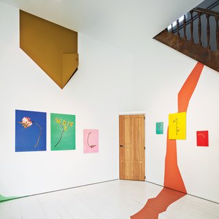 9 Small Spaces With Color - Photo 2 of 9 - Works by Raw Color adorn the walls of the upstairs gallery room of Belgium architect and artist Veerle Wenes.