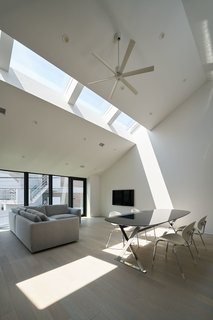 Australian practice PandA Studio Architecture designed House Nakamaruku in Kanagawa, Japan, with skylights on the upper level that bring in plenty of natural light without compromising privacy.