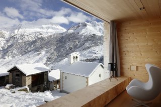 Located in the Graubünden region of the Swiss mountains, this vacation property designed by Swiss architect Peter Zumthor is a modern reinterpretation of the traditional timber houses found in the area of Leis.