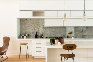 8 Stylish London Apartments - Photo 3 of 8 - Sited in the heart of the Barnsbury Conservation Area, in the middle of a row of Georgian houses, the apartments of Barnsbury Square Lofts bring the steel and glass sleekness of modern architecture into a historic London neighborhood.