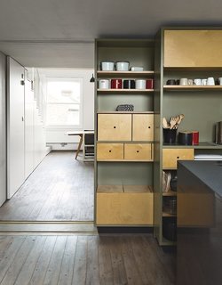8 Stylish London Apartments - Photo 6 of 8 - Architects Silvia Ullmayer and Allan Sylvester helped reinvent metalworker Simone ten Hompel’s 576-square-foot flat with a retractable skylight and smart storage systems.