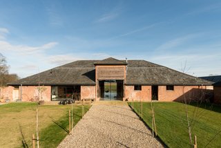 A Suffolk Barn Home With Soaring Ceilings Listed at $1.95M - Photo 2 of 9 -