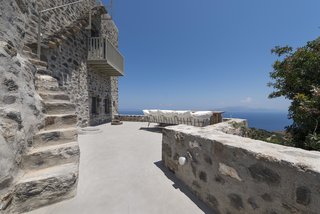 Stay at a Greek Island Villa Among the Ruins of a 14th-Century Castle - Photo 1 of 12 -