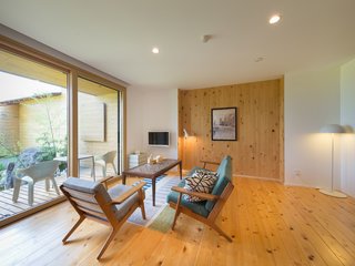 In Minami-Uonuma—just two hours away from Tokyo by train—Sotoyama Jujo is a countryside hotel with cypress-and-cedar wood floors, an outdoor bathtub, stunning mountain views, and furniture by Arne Jacobsen, Hans Wegner, and Isamu Noguchi.