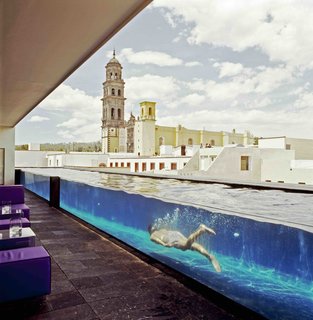 This boutique hotel sits in a former 19th-century water purification faction. Its sleek glass panels and modern furnishings exist in symbiosis with the old factory walls, stone columns, and aqueducts.