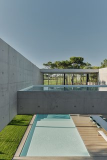A Pool With a Glass Bottom Hovers Over Another at a House in the Portuguese Riviera - Photo 6 of 12 -