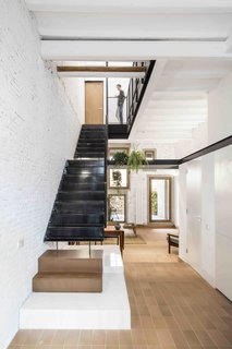 This Double-Height Apartment in
Barcelona Features Historic Details and a Floating Staircase - Photo 2 of 12 -