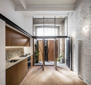 This Double-Height Apartment in
Barcelona Features Historic Details and a Floating Staircase - Photo 4 of 12 -