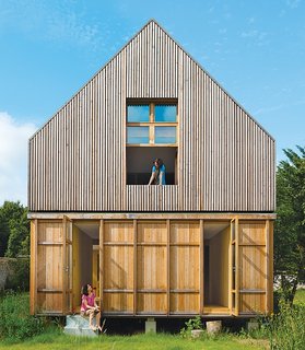9 Eco-Friendly Homes With Smart, Sustainable Features - Photo 4 of 9 - Designed by architecture firm Arba, this A-frame residence just 45-minutes outside of Paris has wood-stove heating, a solar vacuum tube for hot water, a washing machine, and a toilet that uses recycled water. Plus, it's connected to a 100-percent renewable grid that's supplied by French company Enercoop.