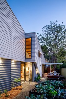 9 Eco-Friendly Homes With Smart, Sustainable Features - Photo 5 of 9 - This Australian home by Perth-based Mountford Architects harvests its own rainwater for laundry, toilets, and graywater irrigation. It has photovoltaic roof panels for electricity generation and its own vegetable garden. 