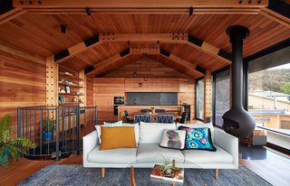 A traditional post-war-style shack near a beach in Lorne, Victoria, was remodeled with a top-level extension to allow for better views of the ocean.