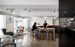 8 Modern Offices That Feel Like Homes - Photo 1 of 8 - Squarespace's Portland office has plenty of open spaces, like this large circular open bar where coworkers can gather and swap ideas.