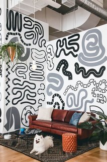 8 Modern Offices That Feel Like Homes - Photo 2 of 8 - Interface design tool company Figma makes employees feel at ease with a cozy, living room-like lounge area and long lunch tables that encourage a strong sense of community.