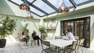 8 Modern Offices That Feel Like Homes - Photo 5 of 8 - As a company that knows the importance of feeling at home, Airbnb’s Paris office was inspired by the city's attic lofts and includes a solarium and roof garden.