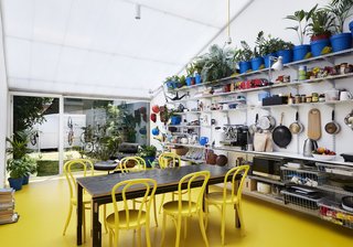 8 Modern Offices That Feel Like Homes - Photo 8 of 8 - Australian architect Andrew Maynard created a sun-drenched extension in his own Melbourne Victorian-terrace home, and transformed it into the office for his practice Austin Maynard Architects. He shares it with his business partner Mark Austin and the rest of his coworkers.