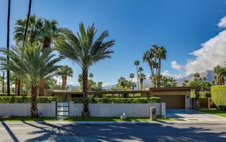 Designed by William Krisel, one of Palm Spring’s most iconic architects, this four-bedroom, midcentury-modern house comes with a private art collection, a backyard that looks out to the mountains, and a swimming pool. 
