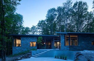 7 Incredible Modern Homes by Canadian Architect Paul Bernier - Photo 3 of 7 - The boundaries between the indoors and outdoors are blurred with breakthroughs and a massive window on the southeast corner that presents stunning diagonal views of the forest. 