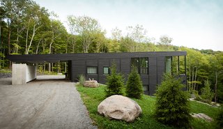 7 Incredible Modern Homes by Canadian Architect Paul Bernier - Photo 4 of 7 - Cedar planks on the exterior walls are dyed black. On the indoor walls, the cedar planks are dyed white. 