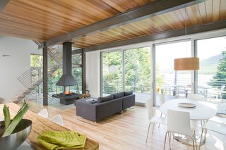 7 Incredible Modern Homes by Canadian Architect Paul Bernier - Photo 7 of 7 - Located on a steep slope that descends toward Lake Archambault, the house’s elevated position presents magnificent views of the lake and surrounding forest. 