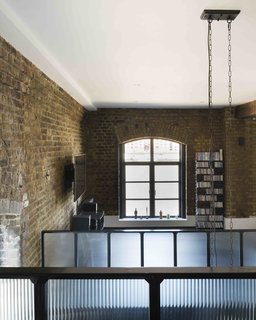 An Old Grain Warehouse on the River Thames Is Transformed Into an Industrial-Modern Home - Photo 3 of 11 -