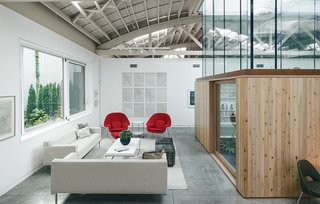 A former warehouse and auto repair shop in Portland was fitted with 11 skylights and a glass atrium in the center, and turned into a chilled-out venue for live music performances.