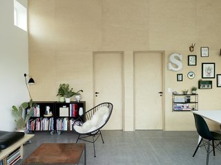 10 Prefabricated or Modular Structures That Use Plywood in Creative Ways - Photo 5 of 11 - Three interlocking materials—a self-heated concrete floor, double-glazed windows that let the outdoors in while keeping out the cold, and wooden panels manufactured in a Danish factory—are used to created this prefab home in Copenhagen with interior birch plywood walls that give the space a bright, open feel. 