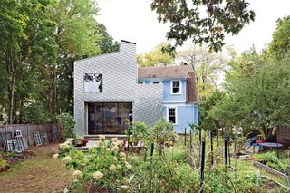 Taking a creative twist on the traditional wood shingle, this Connecticut home uses metal shingles for a cutting-edge, modern look.