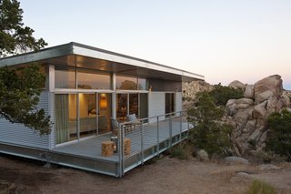 A light-gauge frame made with 70-percent recycled steel helps this prefab rest lightly on its site, resulting in a minimal disruption to the natural desert landscape.