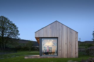 This Company Can Design, Build, and Deliver a Sustainable Prefab in Just 12 Weeks - Photo 1 of 13 - As an Ecospace with a dual-pitched roof, this gym in England’s Peak District has a sloping roof, skylights that brighten and ventilate the space, and a loft-style living space.