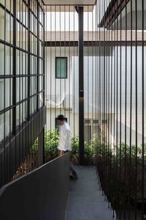 102 Potted Olive Plants Cover the Facade of This Bangkok Home - Photo 2 of 11 -