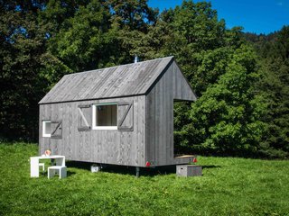 Clad in gray wood, HYT is a mobile home in a Bavarian forest that’s available for holiday rentals. Resembling a hut from the outside, this mobile guesthouse, which is equipped with a mini kitchen, bathroom, and wood stove, has 12 sleeping spaces, and can be towed to just the spot you like by a tractor. The unit is available for approximately $116 for two people per night from Urlaubsarchitektur.