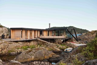 A Norwegian Summer Cabin Embraces the Rocky Terrain - Photo 2 of 10 -