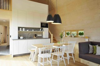 Sited in Hainich–the largest deciduous forest in the northwest of Thuringia, Germany–are the six chalets of Hainichhöfe holiday village. These modular chalets were prefabricated off site. Only the windows and roof tiles were installed on site. Built with spruce and larch wood, the spacious, 753-square-foot chalets with simple Scandinavian-style décor can comfortably fit up to four guests.