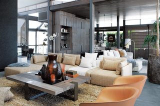 This sophisticated waterfront penthouse in Cape Town, South Africa, offers great views from multiple perspectives within the apartment.