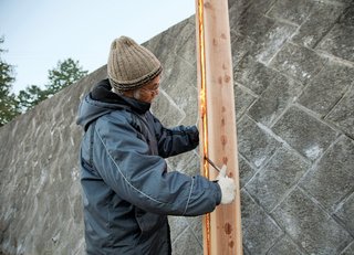 Japanese architect Terunobu Fujimori chars Japanese cedar boards.