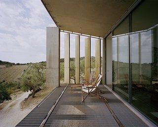 Discover 8 of the Best Mediterranean Homes - Photo 10 of 11 - This three-bedroom villa in the commune of Noto in Sicily has a front portion that’s raised a few feet off the ground and supported by three concrete structures. Its louvered exterior skin can be closed or opened so that guests can enjoy views of the sea from a distance. 
