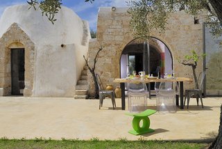 Discover 8 of the Best Mediterranean Homes - Photo 5 of 11 - The trullo has been revamped with clean-lined interiors, full-height glass doors and windows, large terraces, and a new solarium.